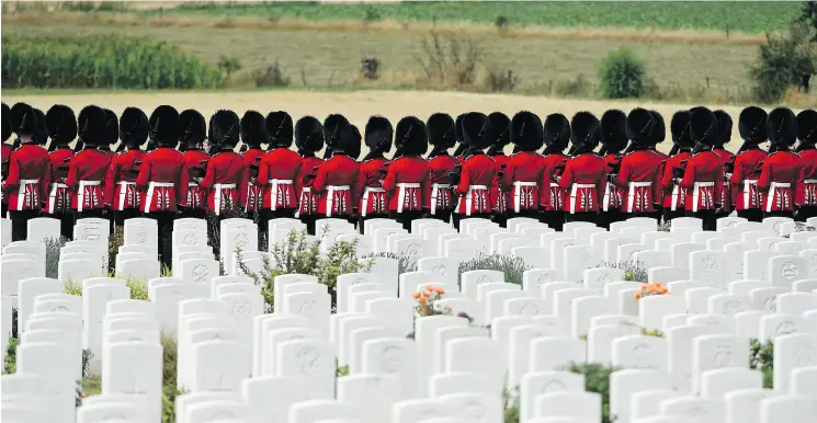  ?? JOHN THYS / AGENCE FRANCE- PRESSE / GETTY IMAGES ?? British Foot Guards participat­e in commemorat­ions for the 100th anniversar­y of the Battle of Passchenda­ele, which took place between July 31 and Nov. 6, 1917, in Belgium.