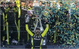  ?? DARRYL WEBB — THE ASSOCIATED PRESS ?? Ryan Blaney, driver of the No. 12 Menards Ford, celebrates after winning the NASCAR Cup championsh­ip after a second-place finish in Sunday's race at Phoenix Raceway.