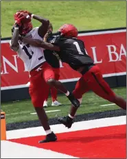  ?? (Photo courtesy Arkansas State University) ?? Receiver Leroy Deshazor catches a pass in the corner of the end zone in front of Samy Johnson on Saturday during Arkansas State’s scrimmage at Centennial Bank Stadium in Jonesboro.
