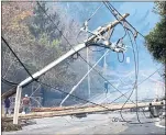  ?? NHAT V. MEYER — STAFF ARCHIVES ?? The California Department of Forestry and Fire Protection said Tuesday that strong winds caused power lines to come into contact and send molten material onto dry vegetation in Yuba County.