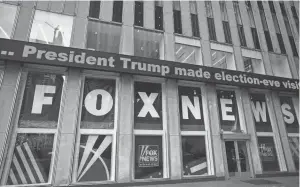  ?? MARK LENNIHAN/AP FILE ?? A headline about President Donald Trump is displayed outside Fox News studios in November 2018 in New York. Attorneys for the cable news giant argued in a countercla­im unsealed Thursday that a $1.6 billion defamation lawsuit against Fox News by Dominion Voting Systems over the network’s coverage of the 2020 presidenti­al election is an assault on the First Amendment.