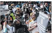  ?? SEAN RAYFORD/GETTY ?? A crowd protests the shooting death of Ahmaud Arbery on Friday at the Glynn County Courthouse in Brunswick.