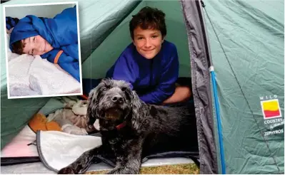  ??  ?? Tough guys! Max Woosey, with his dog Digby, in the tent set up in his garden in Devon