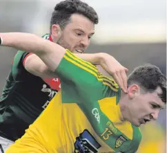  ??  ?? Battle stations: Donegal’s Jamie Brennan (right) can expect another rough and tumble clash against Mayo