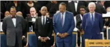  ?? PAUL SANCYA — THE ASSOCIATED PRESS ?? Louis Farrakhan, from left, Rev. Al Sharpton, Rev. Jesse Jackson and former President Bill Clinton attend the funeral service for Aretha Franklin at Greater Grace Temple, Friday in Detroit. Franklin died of pancreatic cancer at the age of 76.