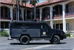  ?? Cory Rubin/The Signal (See additional photos at signalscv.com) ?? A Los Angeles County Sheriff’s Department BearCat sits in front of the Castaic Inn after a barricade suspect was taken into custody on Thursday.