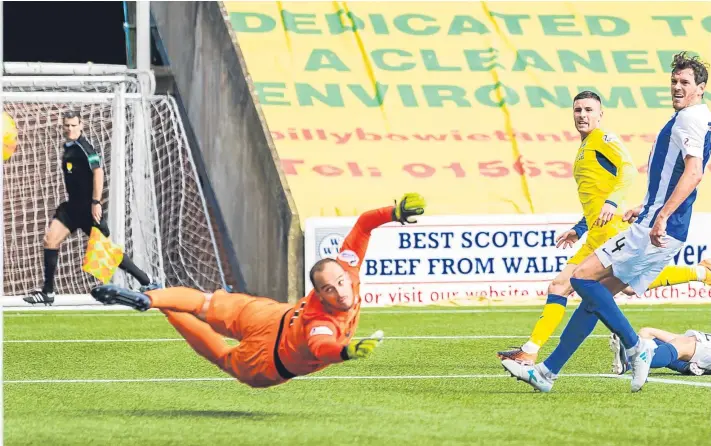  ?? Pictures: SNS Group. ?? Above: Michael O’Halloran watches as his shot beats Kilmarnock goalkeeper Jamie McDonald to win the points for St Johnstone; right: a committed Murray Davidson in a challenge to halt a break from Kilmarnock’s Chris Burke.