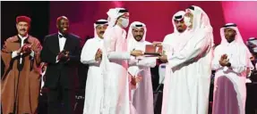  ??  ?? HE the Minister of Culture and Sports Salah bin Ghanem bin Nasser al-Ali honouring Mohamed Rashed.