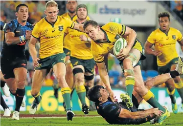  ?? Picture: PATRICK HAMILTON/AFP ?? NOT THEIR FINEST HOUR: Australia’s Dane Haylett-Petty, right, is tackled by Argentina’s Bautista Delguy during the Rugby Championsh­ip match on the Gold Coast on Saturday