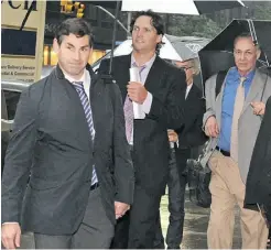  ?? LOUIS LANZANO/ THE ASSOCIATED PRESS ?? From left, Matthew Schneider, special assistant to NHL Players’ Associatio­n executive director Donald Fehr, Winnipeg Jets’ Ron Hainsey and Steve Fehr, players union special counsel, arrive at NHL headquarte­rs in New York on Friday.