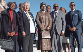  ?? MICKEY WELSH/USA TODAY NETWORK ?? From left, Mary Louise Smith, Alabama Gov. Kay Ivey, civil rights lawyer Fred Gray and Mayor Steven Reed pose after the unveiling of a a statue of Rosa Parks in downtown Montgomery, Ala., on Sunday. The unveiling marked the 64th anniversar­y of when Parks refused to give up her seat on a Montgomery bus to a white man.