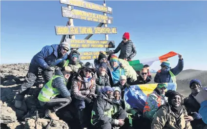  ??  ?? Success
Jamie and the rest of the group at the summit of Mount Kilimanjar­o