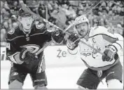  ?? Sean M. Haffey Getty Images ?? WASHINGTON’S Alexander Ovechkin, right, battles the Ducks’ Cam Fowler. Ovechkin had two shots.