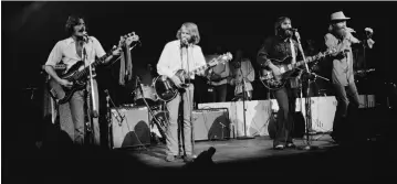  ?? (Don Paulsen/Michael Ochs Archives/Hulton Archive/Getty Images/TNS) ?? THE BEACH BOYS perform at the last night at New York’s The Fillmore East in 1971. From left, Brian Johnston, Al Jardine, Carl Wilson and Mike Love.