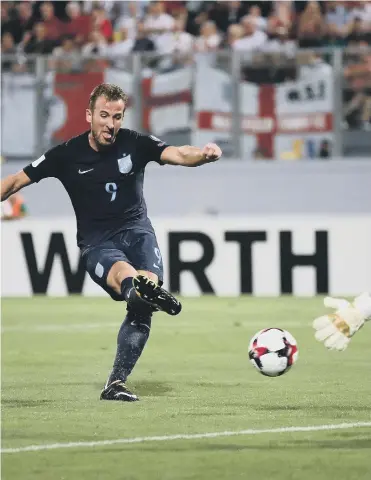  ??  ?? Harry Kane scores England’s opener against Malta on Friday night.