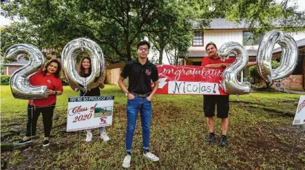  ?? Photos by Karen Warren / Staff photograph­er ?? North Shore High senior Nicolas Cantu is the man of the hour on his front lawn decorated by his parents, Renée and Homer, and sister, Mia, in Channelvie­w. Across Houston, signs and balloons mark houses where graduating seniors live.