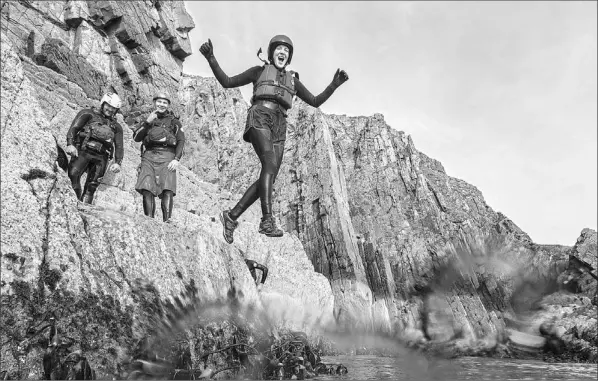  ?? — Photo courtesy Visit Wales ?? The most exhilarati­ng part of coasteerin­g is the cliff jump.