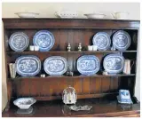  ?? HANSONS ?? Main, the Old Hall. Clockwise from above: blue and white ceramics, George III elm dresser, circa 1780, and early 20th century Dutch leather suitcase and similar cases