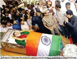  ??  ?? TN Governor C.vidyasagar Rao paying his respects to mortal remains of Jayalalith­aa at Rajaji Hall,chennai