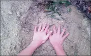  ??  ?? BIGFOOT: The hands of young Righardt Stander are dwarfed by the elephant’s footprint.