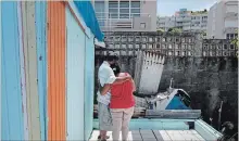  ?? ROMAIN BLANQUART TNS ?? Luz Delgado comforts her husband, Eleobadis, while talking about the hardships Puerto Ricans are experienci­ng physically and emotionall­y since Hurricane Maria devastated the island 10 months prior.