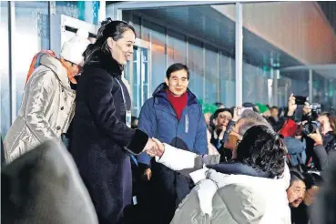  ?? PHOTO] ?? Kim Yo Jong, left, sister of North Korean leader Kim Jong Un, shakes hands with South Korean President Moon Jae-in Friday at the opening ceremony of the 2018 Winter Olympics in Pyeongchan­g, South Korea.[AP