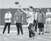  ?? MIKE STOCKER/SOUTH FLORIDA SUN SENTINEL ?? Quarterbac­k Ryan Rizk throws the ball at the UM Carol Soffer Indoor Practice Facility on Wednesday during the Miami Pro Day in preparatio­n for the NFL draft.