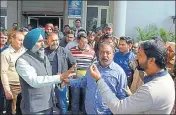  ?? HT PHOTO ?? MLA Pargat Singh arguing with an employee outside the MC office in Jalandhar on Wednesday.