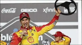  ?? JOHN RAOUX / ASSOCIATED PRESS ?? Joey Logano celebrates in Victory Lane after winning the first of two NASCAR Daytona 500 qualifiers at Daytona Internatio­nal Speedway on Thursday. He’ll start from the second row in Sunday’s season-opening race.