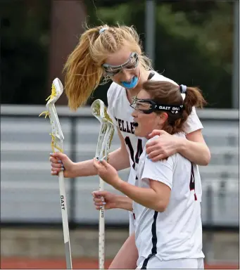  ?? STAFF PHOTO — STUART CAHILL/BOSTON HERALD ?? Wellesley’s Tara Battaglino and Kaitlyn Uller, right, celebrate a goal during a 19-3victory over Franklin on Saturday.