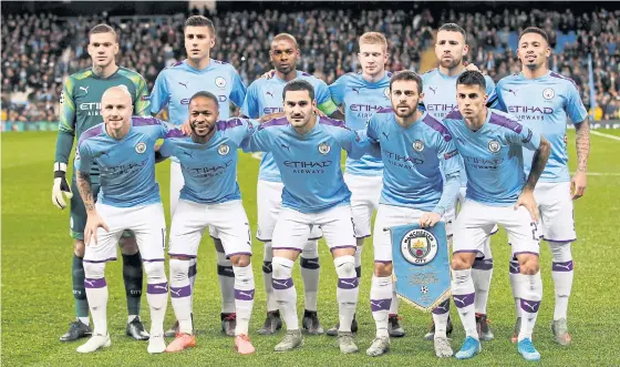  ??  ?? Manchester City players pose before a Champions League match this season.