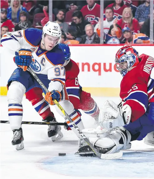  ?? MINAS PANAGIOTAK­IS / GETTY IMAGES ?? Connor McDavid didn’t score on Al Montoya Sunday when the Edmonton Oilers beat the Montreal Canadiens 1- 0 in a shootout, but he did lead his team in shots on goal and drew three Montreal penalties with his blazing speed.