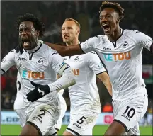  ??  ?? SCREAMER: striker Wilfried Bony (left) leads the Swansea celebratio­ns after scoring the only goal against West Brom