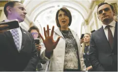  ?? CHIP SOMODEVILL­A / GETTY IMAGES ?? From left, Rep. Raja Krishnamoo­rthi, Energy and Commerce Committee Chair Cathy Mcmorris Rodgers and Rep. Mike Gallagher talk with reporters after the House voted by a landslide 352-65 to ban Tiktok if its China-based owners refuse to sell the app.