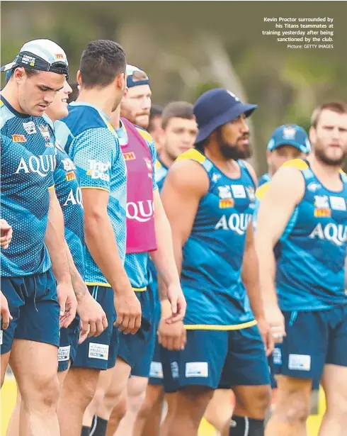  ??  ?? Kevin Proctor surrounded by his Titans teammates at training yesterday after being sanctioned by the club. Picture: GETTY IMAGES