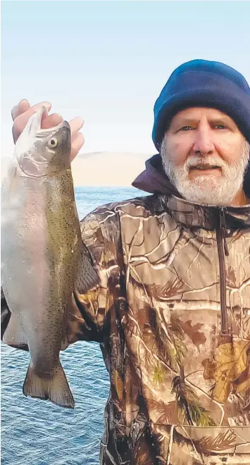  ??  ?? PATIENT: Martinus de Lange with his 1.5kg rainbow trout from Lake Bullen Merri.