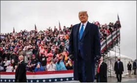  ?? (The New York Times/Doug Mills) ?? President Donald Trump holds a campaign rally Tuesday in Lansing, Mich. “This election is a matter of economic survival for Michigan,” Trump declared, arguing that the state’s economy was strong before the coronaviru­s pandemic hit. “Look what I’ve done.”