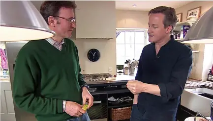 ??  ?? Domestic policy: David Cameron is interviewe­d in his kitchen in Oxfordshir­e by the BBC’s James Landale