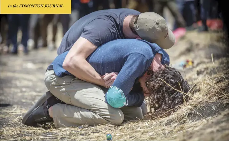  ?? Mulugeta ayene / the associated press ?? Relatives of passengers react Wednesday at the site of Sunday’s crash of an Ethiopian Airlines Boeing 737 Max 8 plane south of Addis Ababa, Ethiopia, which killed all 157 on board.