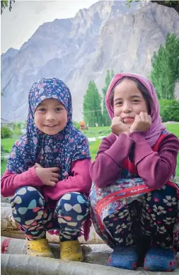  ??  ?? (Above) Two young girls sit in an apricot orchard; (left) Ali the ‘walking talking’ encycloped­ia of Turtuk