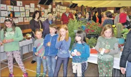  ?? 26_t36bend4 ?? AND THE WINNER IS...children wait patiently to find out the results of the trophy
winners and the raffle