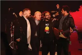  ??  ?? Dan Sultan, Paul Kelly and A.B. Original after performing their update of Dumb Things. Photograph: Scott Barbour/Getty Images for ARIA