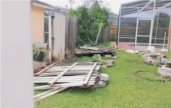  ?? CORTESÍA MILLIE MOLINA ?? Aunque menores en comparació­n a otros lugares, Irma dejó daños en el área de Orlando, como en la casa de Millie Molina.