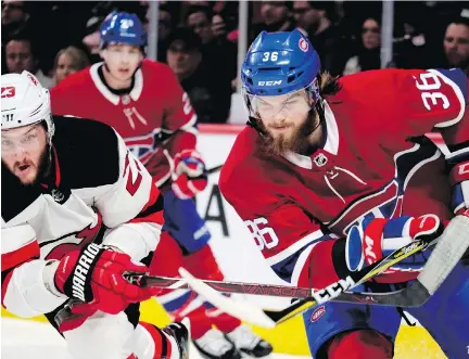  ?? ALLEN MCINNIS ?? New Jersey winger Stefan Noesen and Canadiens defenceman Brett Lernout get their sticks crossed during action on Sunday night. The Habs came up short against the Devils but will try to rebound Tuesday night when they host Winnipeg in the final game at...