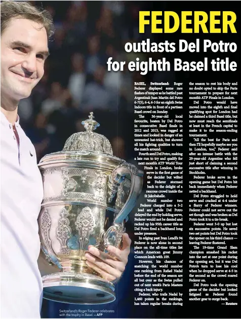  ?? — AFP ?? Switzerlan­d’s Roger Federer celebrates with the trophy in Basel.