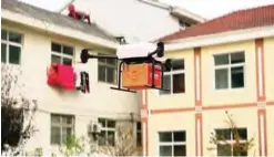  ?? —AP ?? JIANGSU PROVINCE: In this image taken from a Nov 9, 2016 video footage by AP Video, a drone takes off to deliver JD.com parcel from Tiantong’an village near Suqian city.