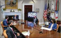  ?? PATRICK SEMANSKY/ASSOCIATED PRESS ?? President Joe Biden and other U.S. officials participat­e virtually in the CEO Summit on Semiconduc­tor and Supply Chain Resilience in the Roosevelt Room of the White House on Monday. The meeting came as the global chip shortage continued to plague a wide array of industries.