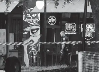  ??  ?? A Jacksonvil­le Sheriff officer yesterday walks past the GLHF Game Bar where three people, including the gunman, were killed at the Jacksonvil­le Landing in Jacksonvil­le, Florida. The gunman, himself a participan­t, opened fire during a video game tournament on Sunday.— AFP