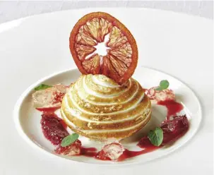  ??  ?? Santé Restaurant’s blood orange baked Alaska with champagne gelée, Grand Marnier and chocolate mint