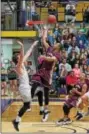  ??  ?? Kutztown’s Josh Johnson scores a layup against West Chester last week. (Dennis Krumanocke­r - For Digital First Media)